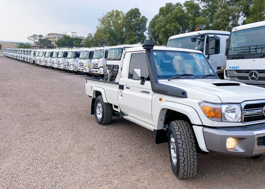 Rua-Con bakkie in front of a line of fleet vehicles