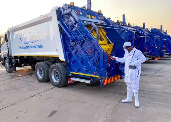 Blue rear-loading compactor body on a Rua-Con truck